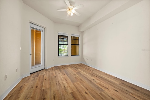 spare room with ceiling fan and light hardwood / wood-style flooring