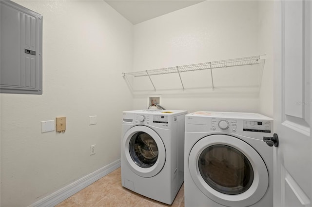 laundry area featuring separate washer and dryer, electric panel, and light tile patterned flooring