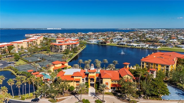 birds eye view of property with a water view