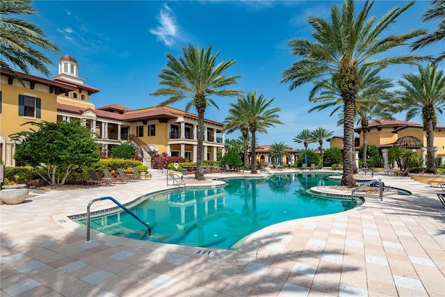 view of swimming pool with a patio