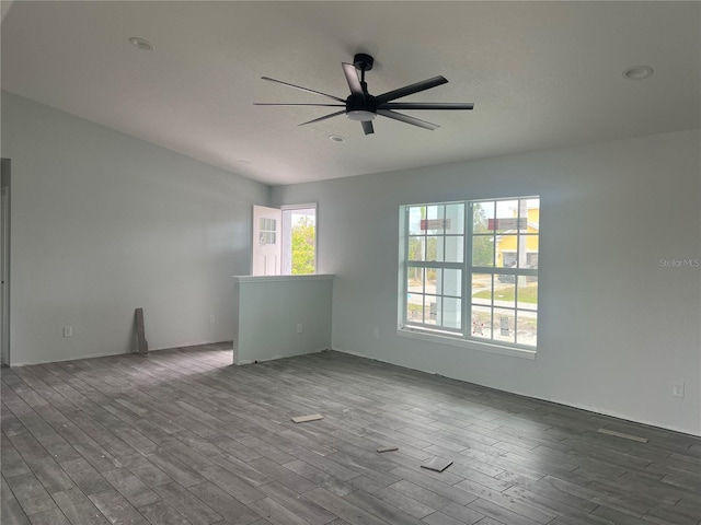 unfurnished room with a ceiling fan and wood finished floors