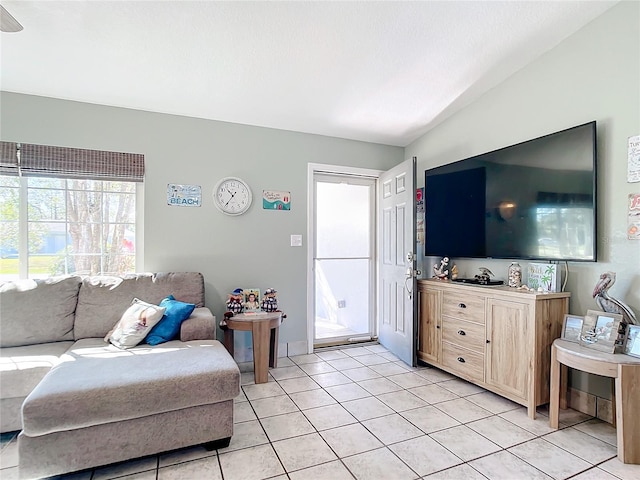 tiled living room with vaulted ceiling