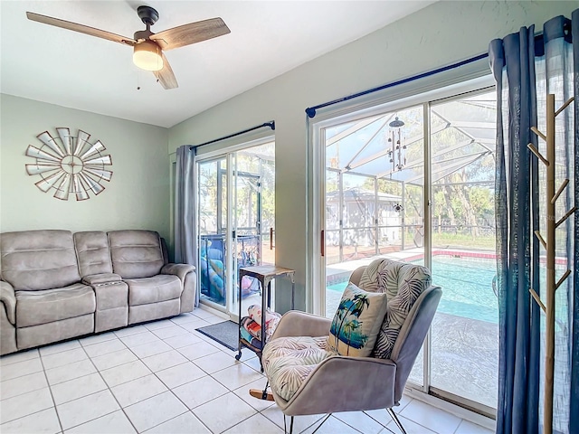 tiled living room with ceiling fan