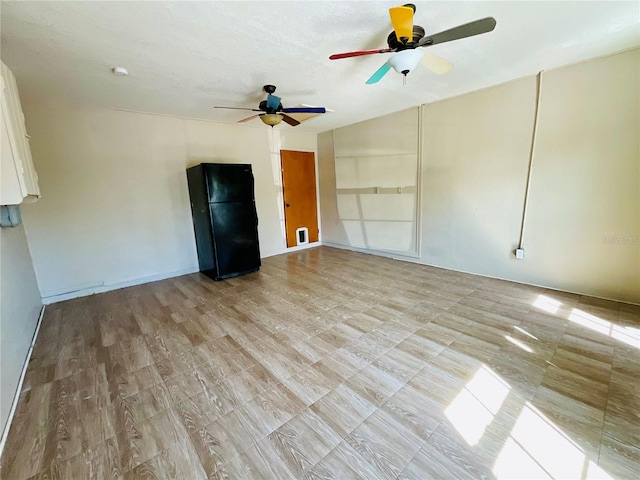 interior space with ceiling fan