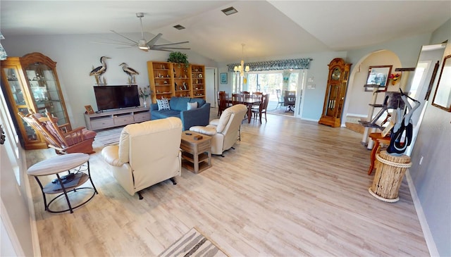 living room with ceiling fan, light hardwood / wood-style flooring, and lofted ceiling