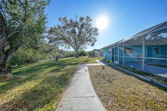 view of yard featuring a lanai