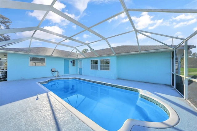 view of pool with a lanai and a patio area