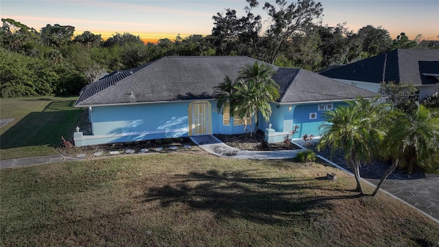 view of front of home featuring a yard