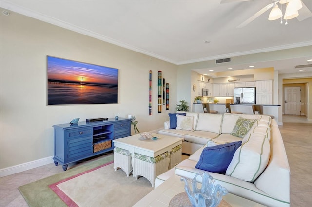 tiled living room featuring crown molding and ceiling fan