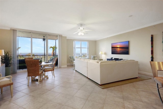 3321 Sunset Key Cir Unit 204, Punta Gorda, FL 33955 - living area featuring a ceiling fan, ornamental molding, and light tile patterned floors