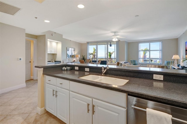 kitchen with white cabinetry, ceiling fan, stainless steel dishwasher, and sink