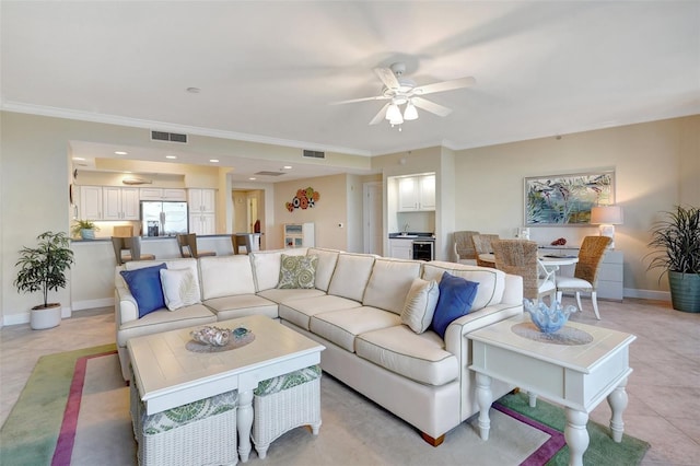 tiled living room with ceiling fan and ornamental molding