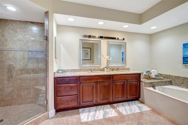 bathroom featuring tile patterned floors, vanity, and separate shower and tub