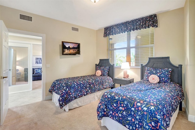 bedroom featuring light colored carpet