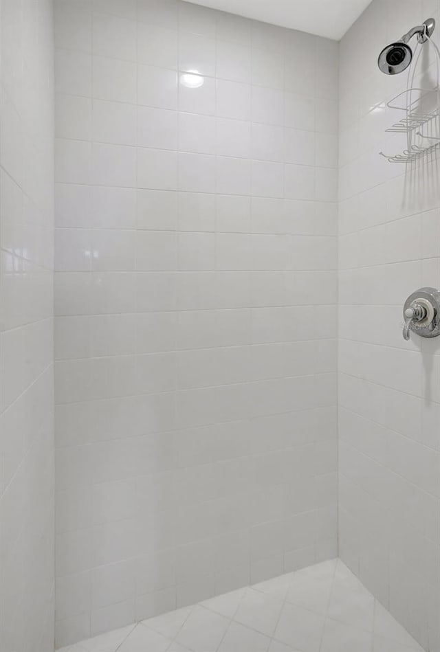 bathroom with tiled shower