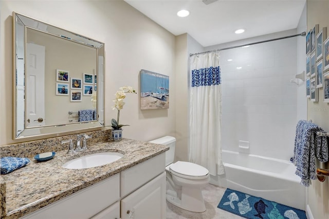 full bathroom with tile patterned floors, shower / bath combination with curtain, toilet, and vanity