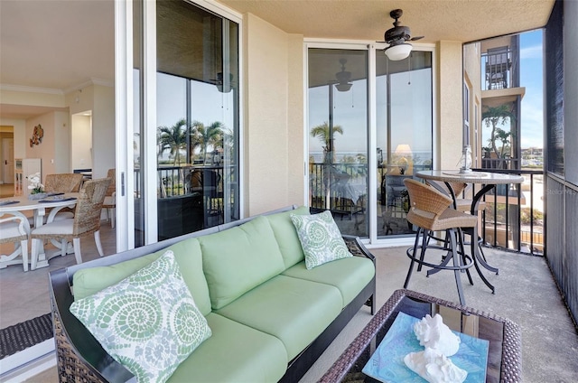 sunroom / solarium with ceiling fan and a wealth of natural light