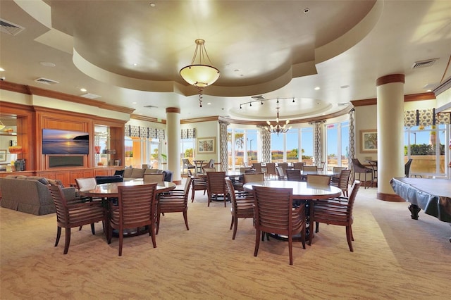 dining room featuring a raised ceiling, billiards, ornamental molding, a notable chandelier, and light colored carpet