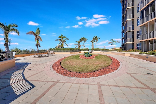 surrounding community featuring a patio