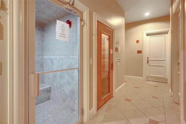 corridor with light tile patterned flooring