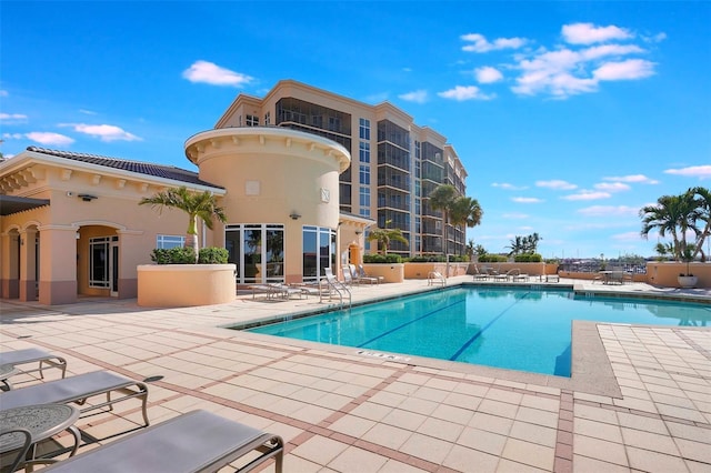 view of swimming pool with a patio