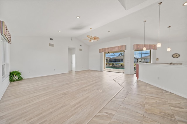 unfurnished living room with ceiling fan, light hardwood / wood-style floors, and lofted ceiling