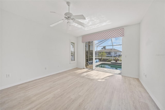 spare room with ceiling fan and light hardwood / wood-style floors