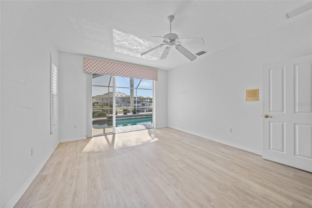 unfurnished room featuring ceiling fan and light hardwood / wood-style floors