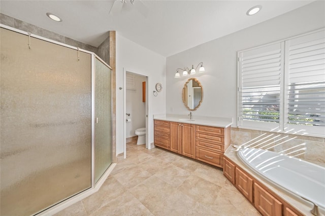 full bathroom with separate shower and tub, tile patterned flooring, vanity, and toilet