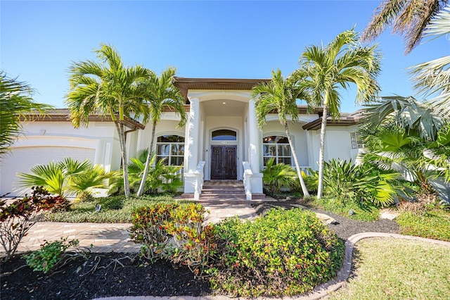 view of front of property with a garage