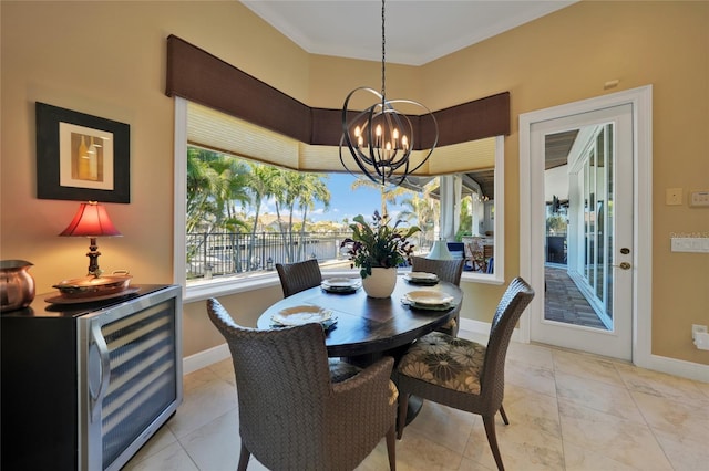 dining room featuring ornamental molding, beverage cooler, light tile patterned floors, a water view, and a notable chandelier