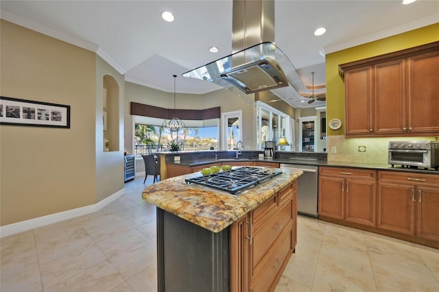 kitchen with a center island, sink, dark stone countertops, island range hood, and stainless steel appliances