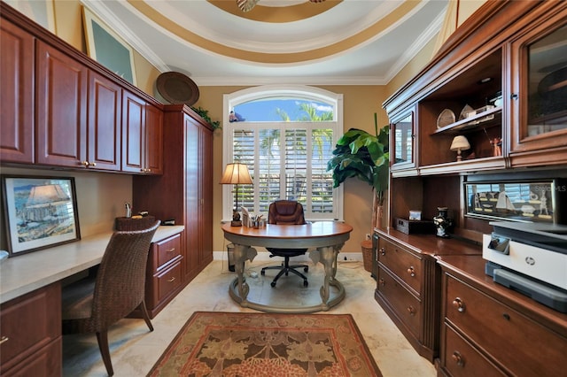 office area featuring built in desk, ornamental molding, light tile patterned floors, and a tray ceiling