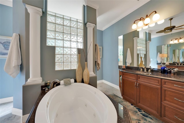 bathroom featuring a washtub, decorative columns, ceiling fan, and ornamental molding