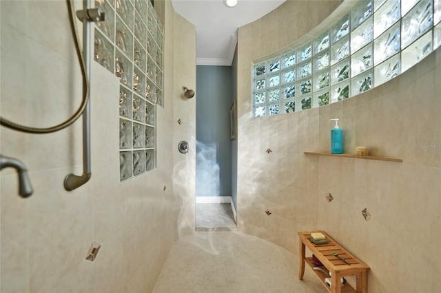 bathroom featuring crown molding, tile walls, and walk in shower