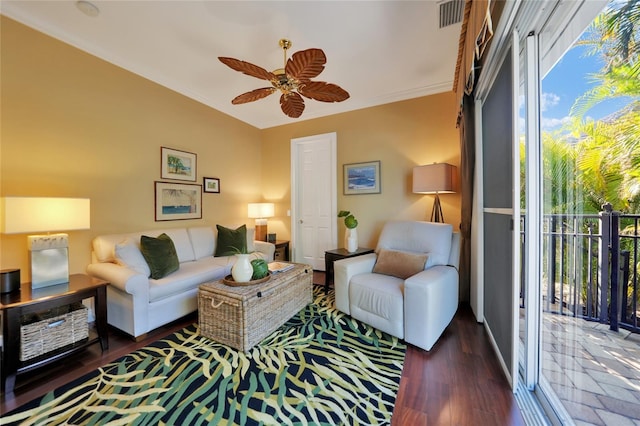 living room with dark hardwood / wood-style flooring, a wealth of natural light, crown molding, and ceiling fan