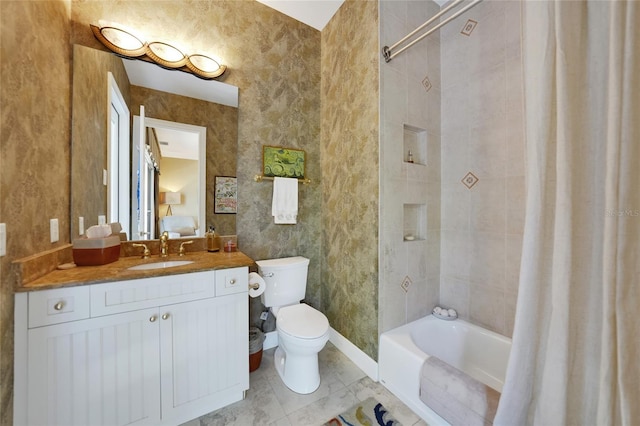 full bathroom featuring vanity, toilet, and shower / tub combo with curtain