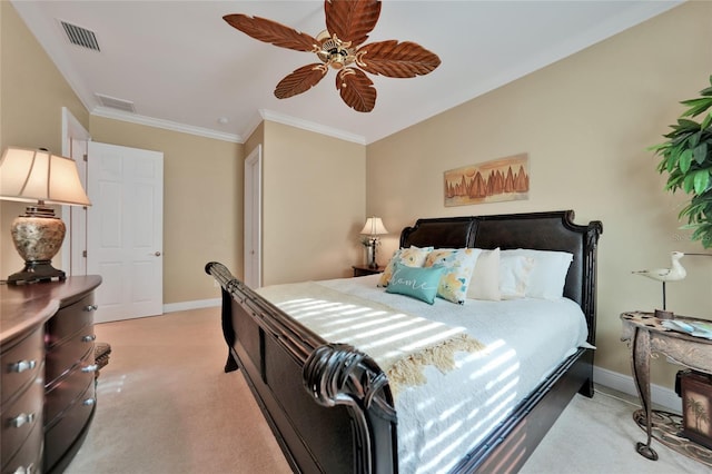 carpeted bedroom with ceiling fan and crown molding