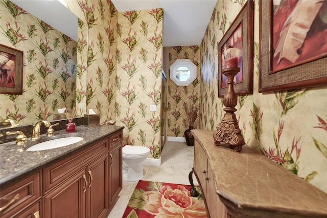 bathroom with vanity and toilet