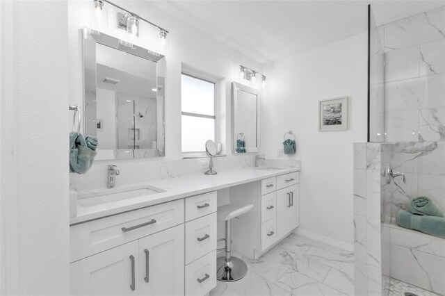 bathroom featuring vanity and tiled shower