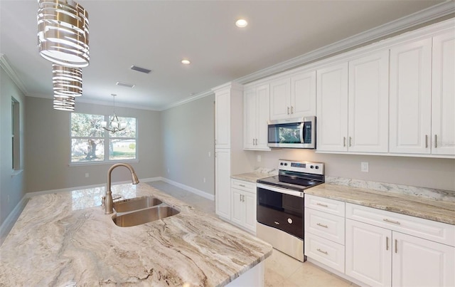 kitchen featuring white cabinets, sink, hanging light fixtures, stainless steel appliances, and a chandelier