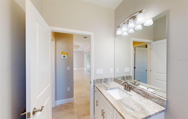 bathroom with tile patterned floors and vanity