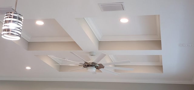 details featuring ceiling fan with notable chandelier