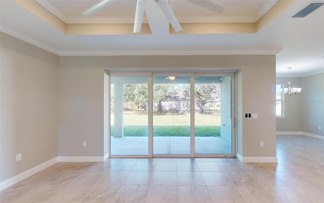 unfurnished room featuring a healthy amount of sunlight, ceiling fan with notable chandelier, and ornamental molding