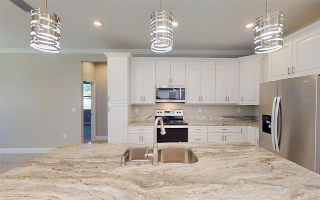 kitchen featuring pendant lighting, white cabinetry, sink, and stainless steel appliances