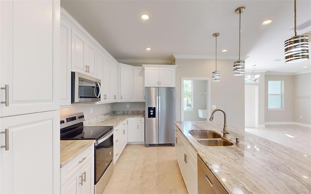 kitchen featuring a healthy amount of sunlight, light stone countertops, white cabinets, and stainless steel appliances