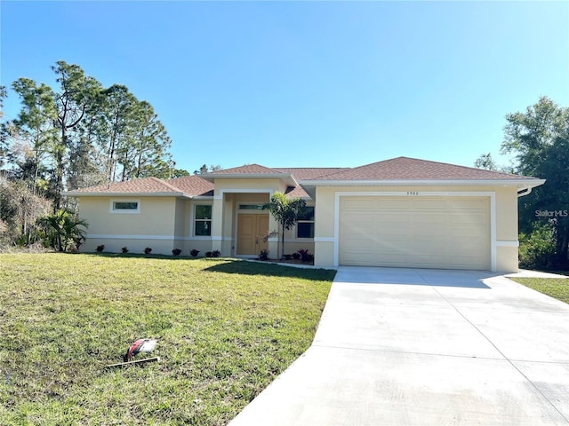 view of front of home featuring a front lawn and a garage