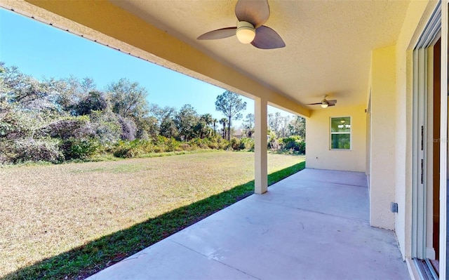 view of patio featuring ceiling fan