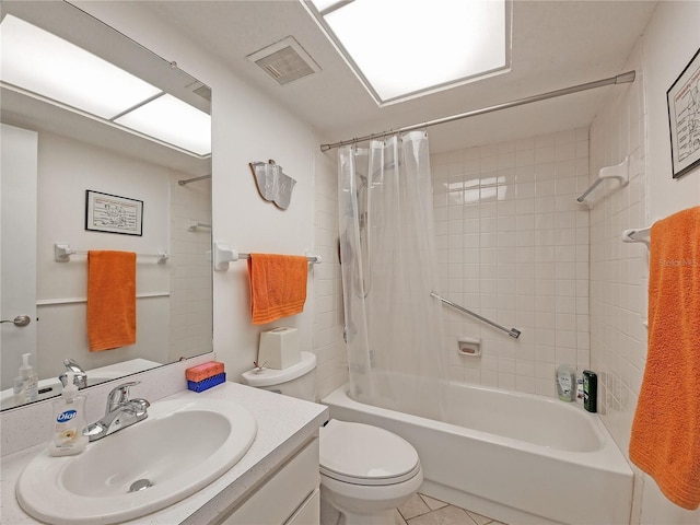 full bathroom featuring tile patterned flooring, shower / bath combination with curtain, toilet, and vanity