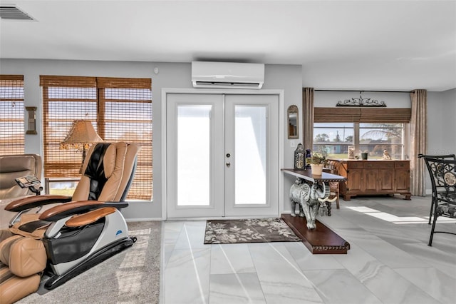 foyer featuring a wall mounted air conditioner, french doors, and plenty of natural light